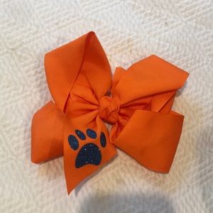 Orange bow with blue paw print
